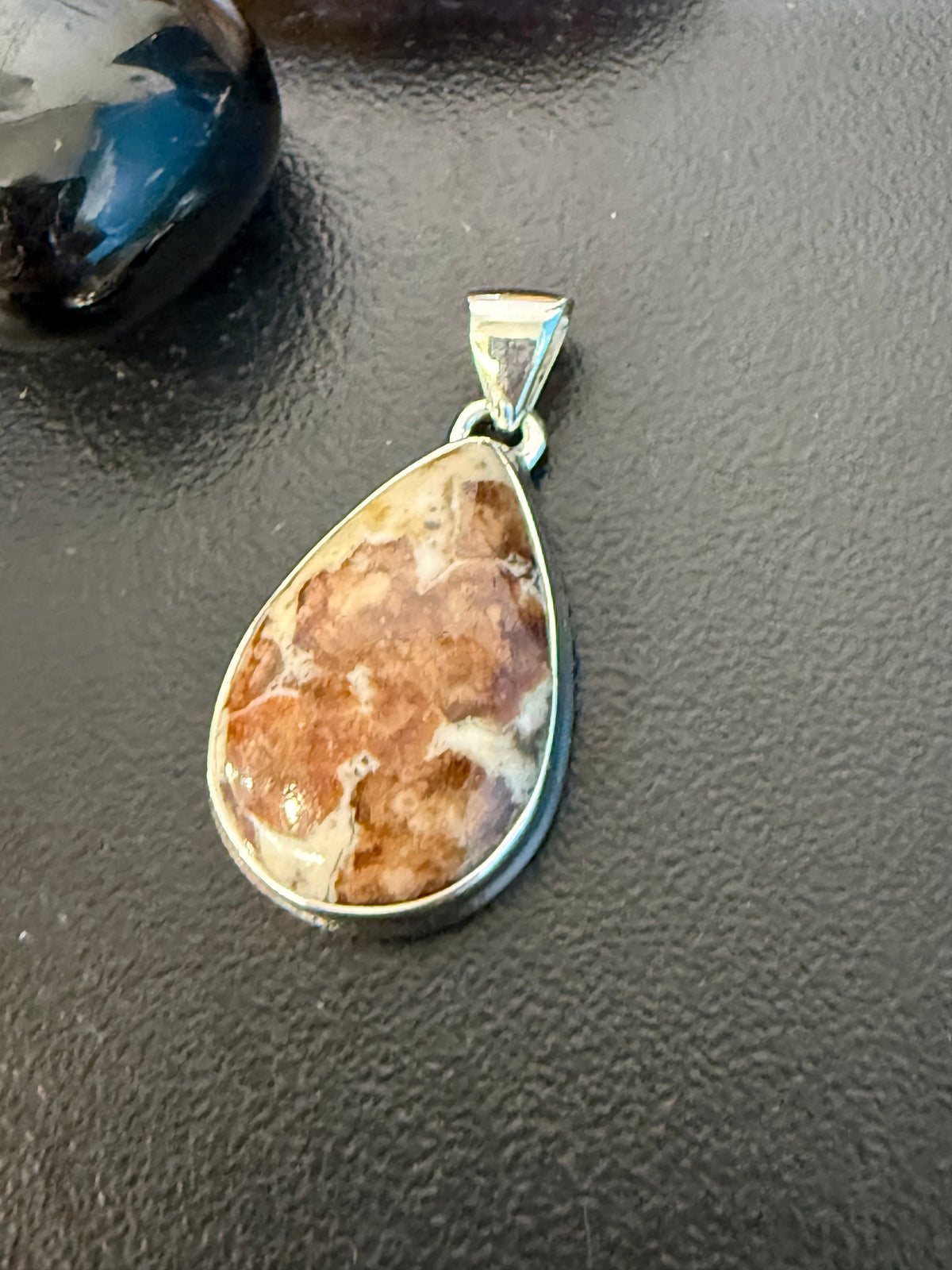 SPESSARTINE GARNET IN LIMESTONE SILVER PENDANT
“Stone of Passion, Creativity & Abundance” Crystal Wellness