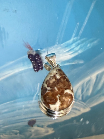 SPESSARTINE GARNET IN LIMESTONE SILVER PENDANT
“Stone of Passion, Creativity & Abundance” Crystal Wellness
