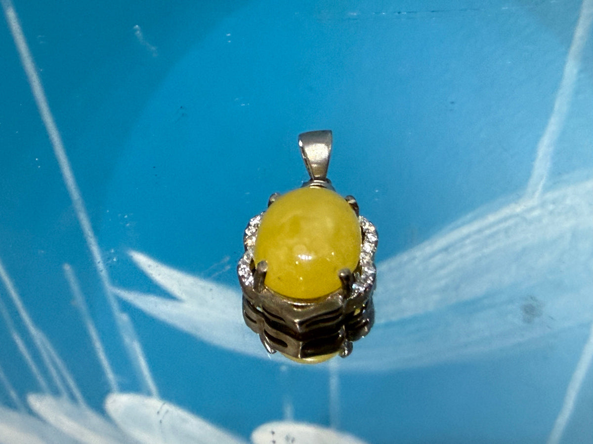 Butterscotch Amber with Zircon Pendant

Warmth • Vitality • Clarity • Inner Light, 20mmx14mm Crystal Wellness