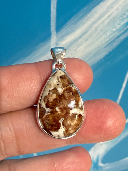 SPESSARTINE GARNET IN LIMESTONE SILVER PENDANT
“Stone of Passion, Creativity & Abundance” Crystal Wellness
