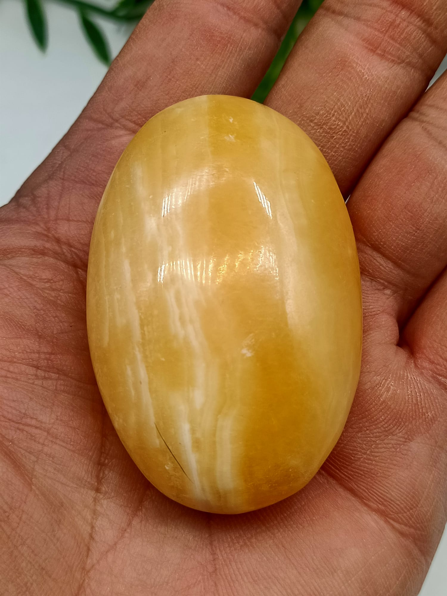 Orange Calcite Palm Stone Crystal Wellness