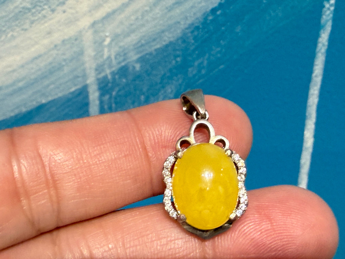Butterscotch Amber with Zircon Pendant

Warmth • Vitality • Clarity • Inner Light, 20mmx14mm Crystal Wellness