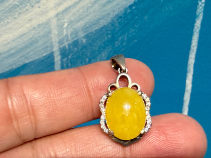 Butterscotch Amber with Zircon Pendant

Warmth • Vitality • Clarity • Inner Light, 20mmx14mm Crystal Wellness