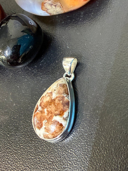 SPESSARTINE GARNET IN LIMESTONE SILVER PENDANT
“Stone of Passion, Creativity & Abundance” Crystal Wellness